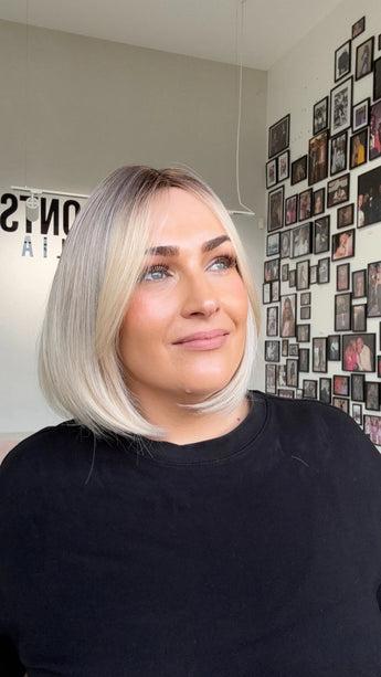 glueless 12 inch bob synthetic wig, gold coast australia, darker root with long fringe parted to side.