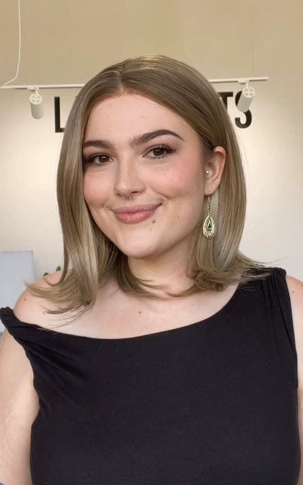 natural looking dark blonde bob length synthetic wig.