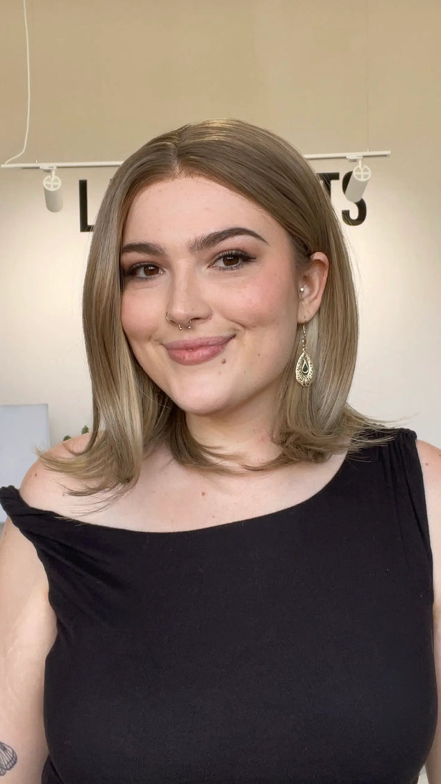 natural looking dark blonde bob length synthetic wig.