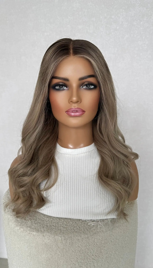 lace front wig, ash blonde, darker root with face framing highlight.