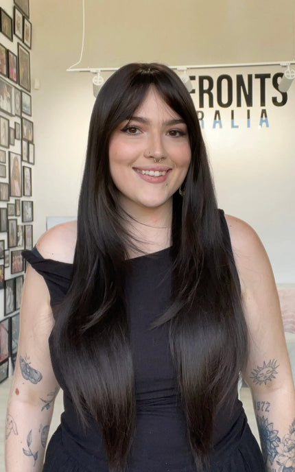 dark brunette hair wig with layered hair, middle part with long fringe.
