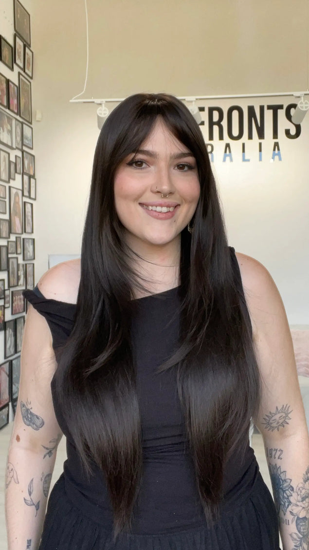 dark brunette hair wig with layered hair, middle part with long fringe.