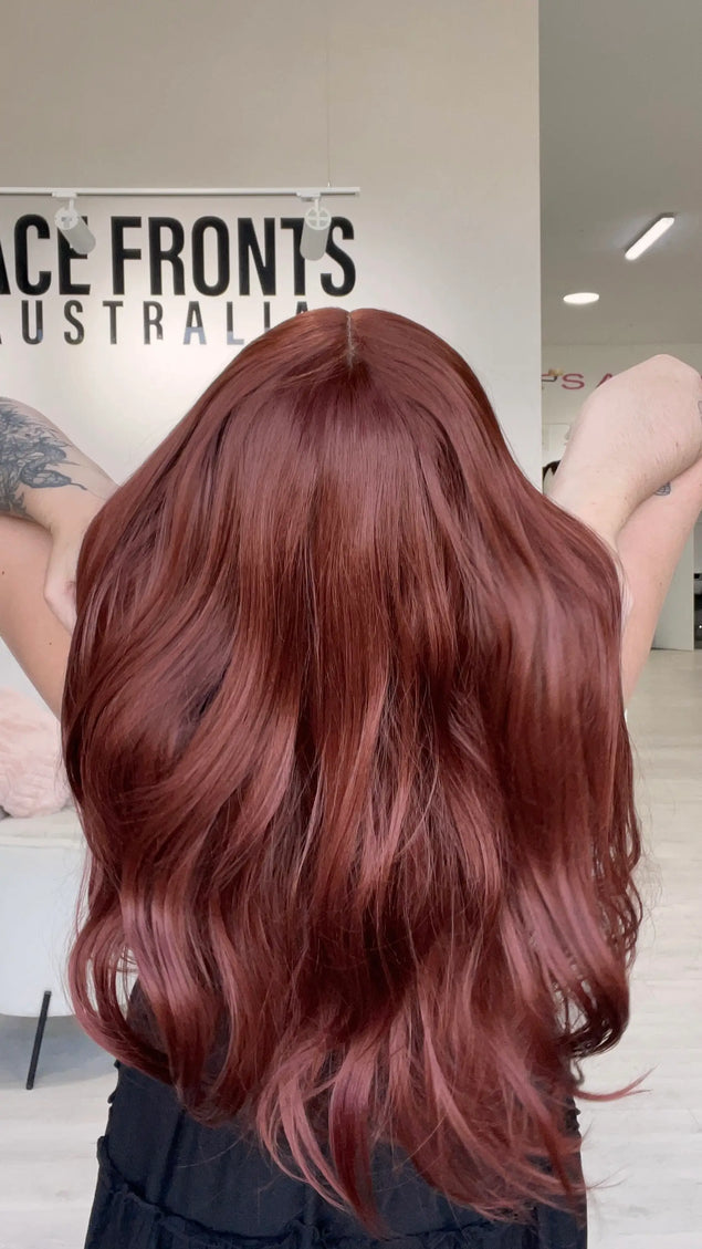 natural looking lace front glueless wig with long red hair.