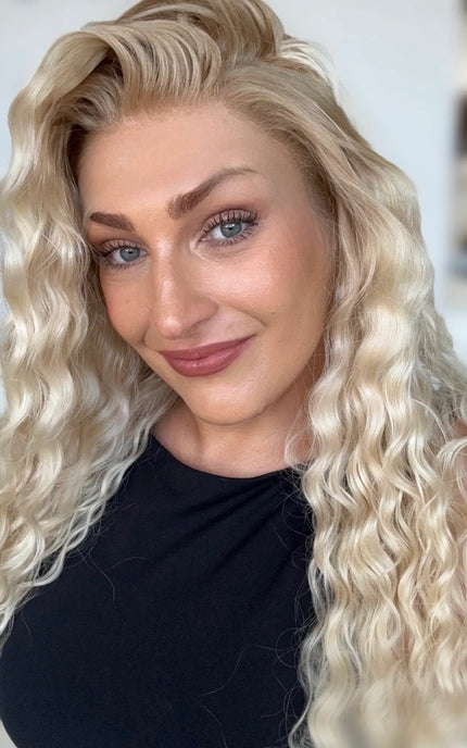 right side part creamy blonde curly hair wig with long length hair, natural looking hairline with glueless cap and adjustable straps.