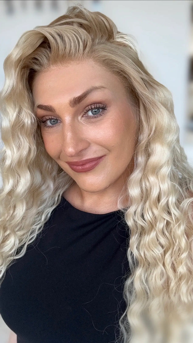 right side part creamy blonde curly hair wig with long length hair, natural looking hairline with glueless cap and adjustable straps.