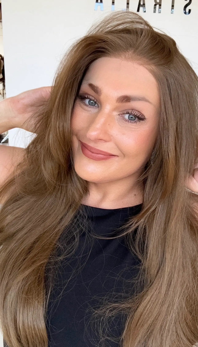 lace front glueless wig with right side part and layers throughout, bouncy blowdry styling.