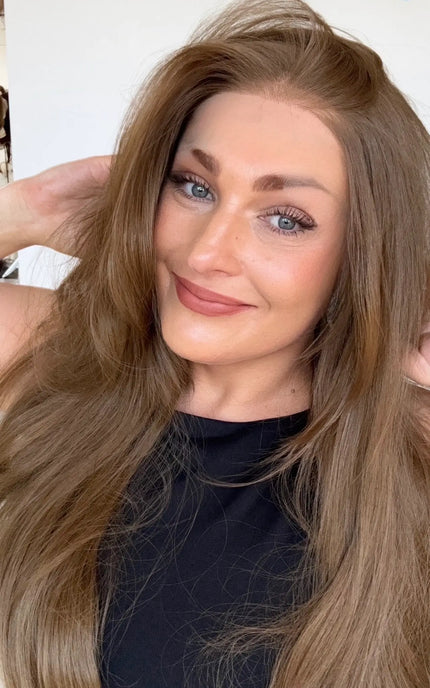 lace front glueless wig with right side part and layers throughout, bouncy blowdry styling.