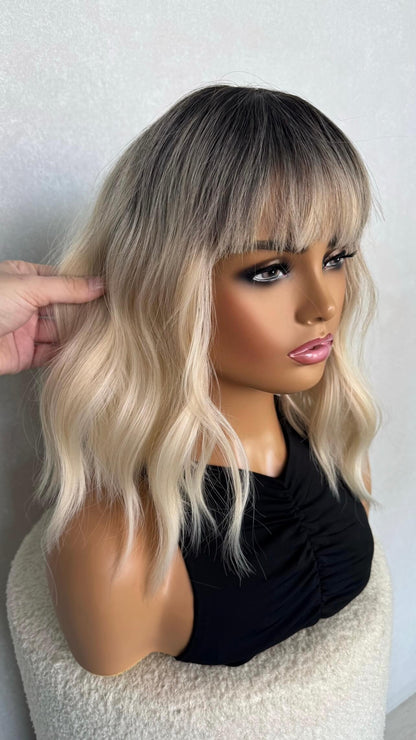 side view, selena platinum blonde synthetic wig . short, 14 inches. 