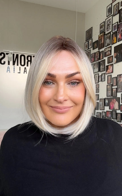 natural looking short blonde bob length synthetic wig for daily wear.