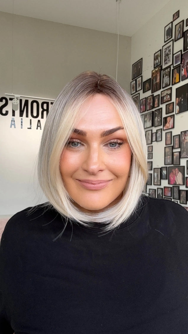 natural looking short blonde bob length synthetic wig for daily wear.