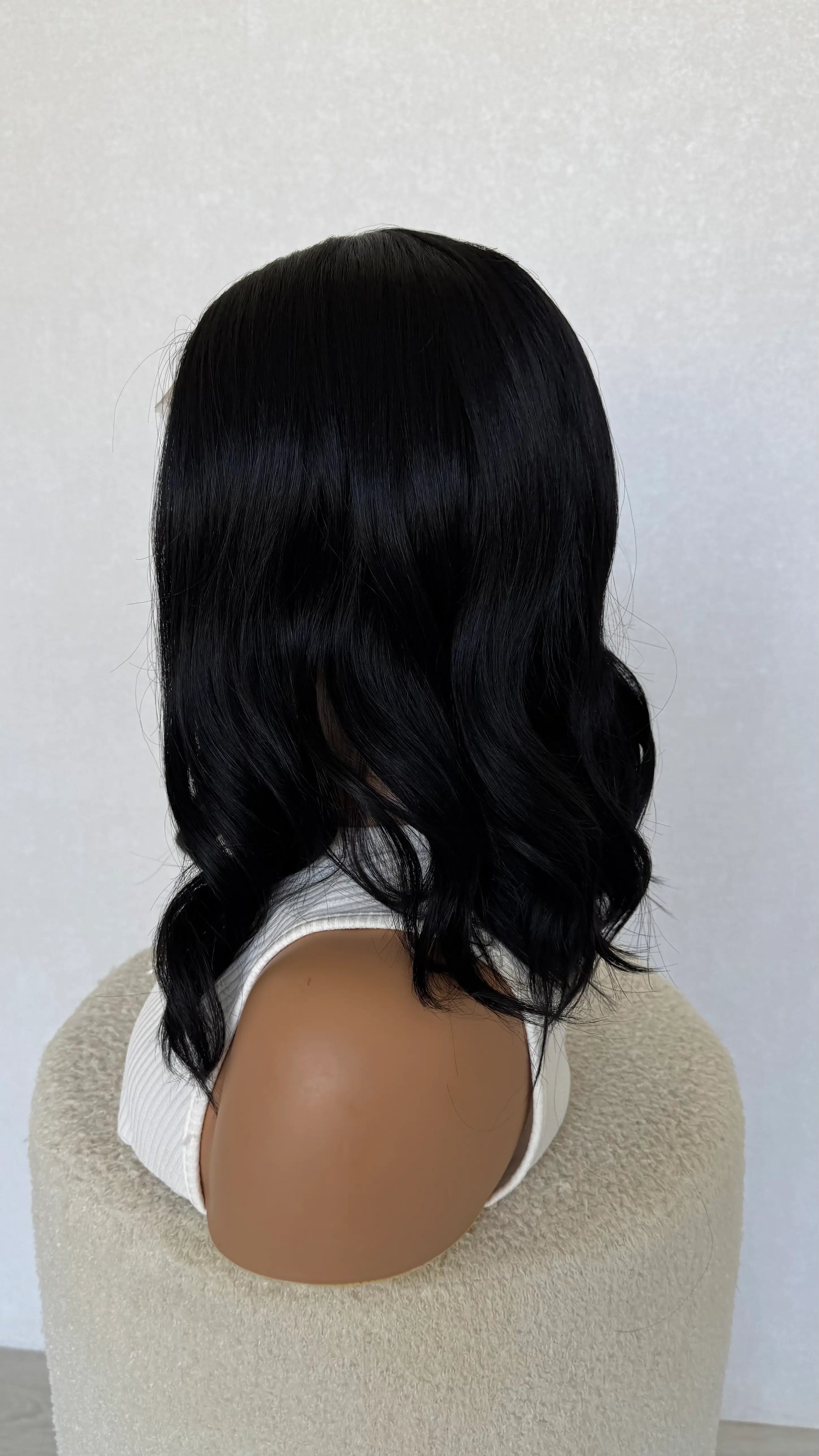 side on view, lacefront black synthetic wig, heat safe, glueless wig.
