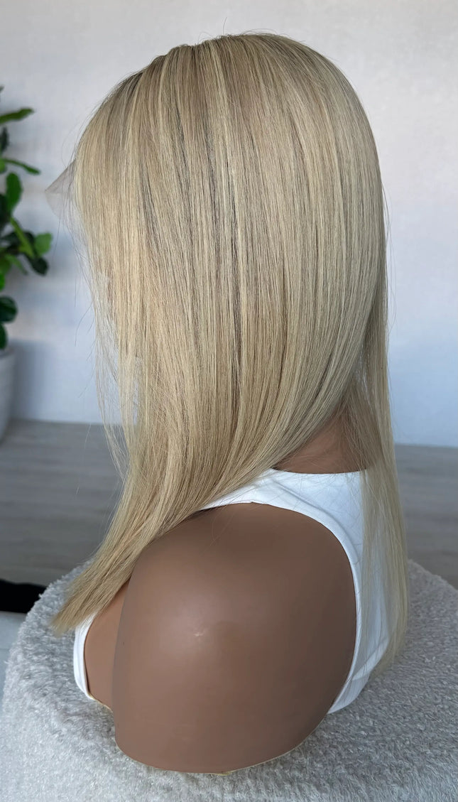 crystal human hair wig, lacefront, brazilian remy hair with middle part. side on view showcasing colour