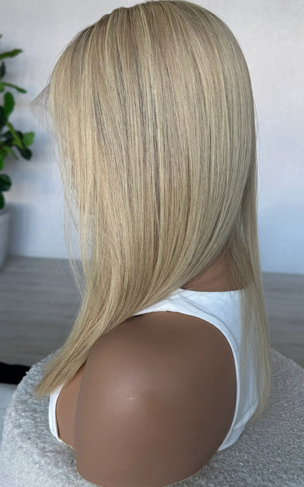 crystal human hair wig, lacefront, brazilian remy hair with middle part. side on view showcasing colour