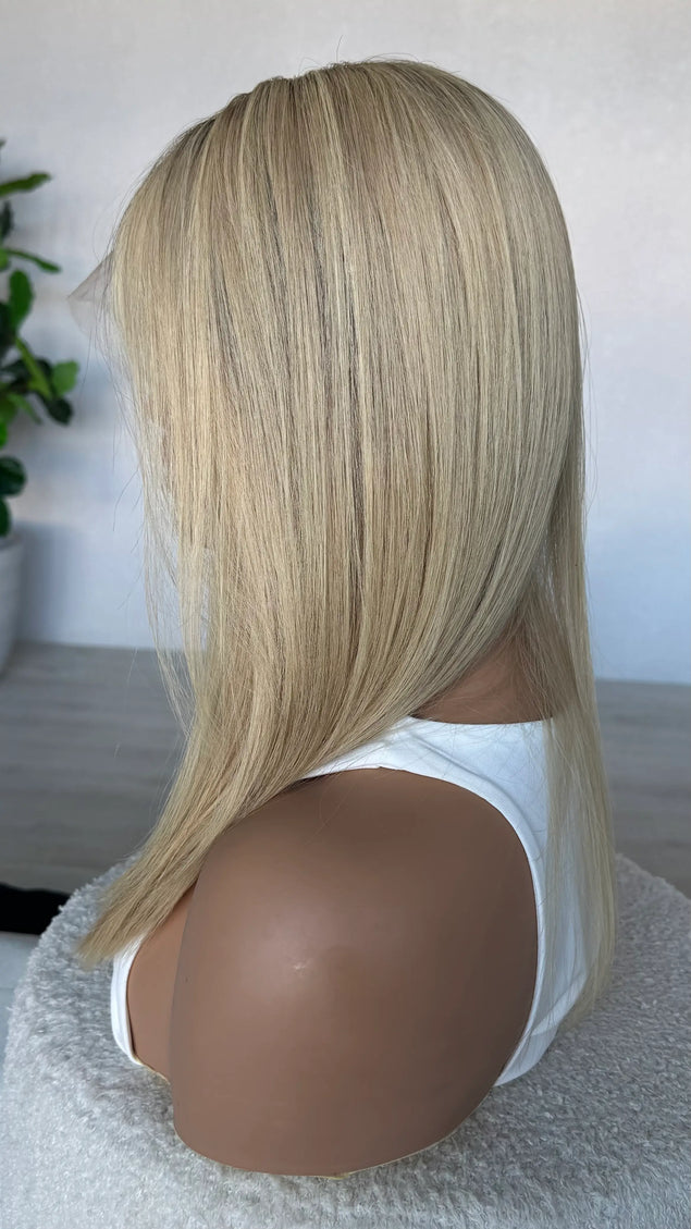 crystal human hair wig, lacefront, brazilian remy hair with middle part. side on view showcasing colour
