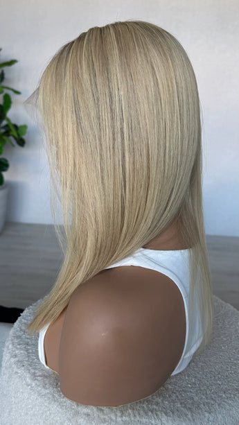 crystal human hair wig, lacefront, brazilian remy hair with middle part. side on view showcasing colour