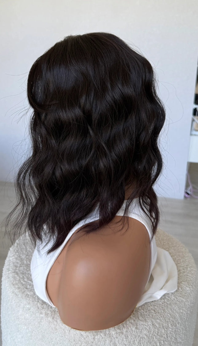 wavy hair synthetic side on view, dark brunette.