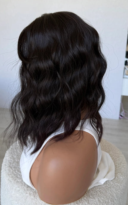 wavy hair synthetic side on view, dark brunette.