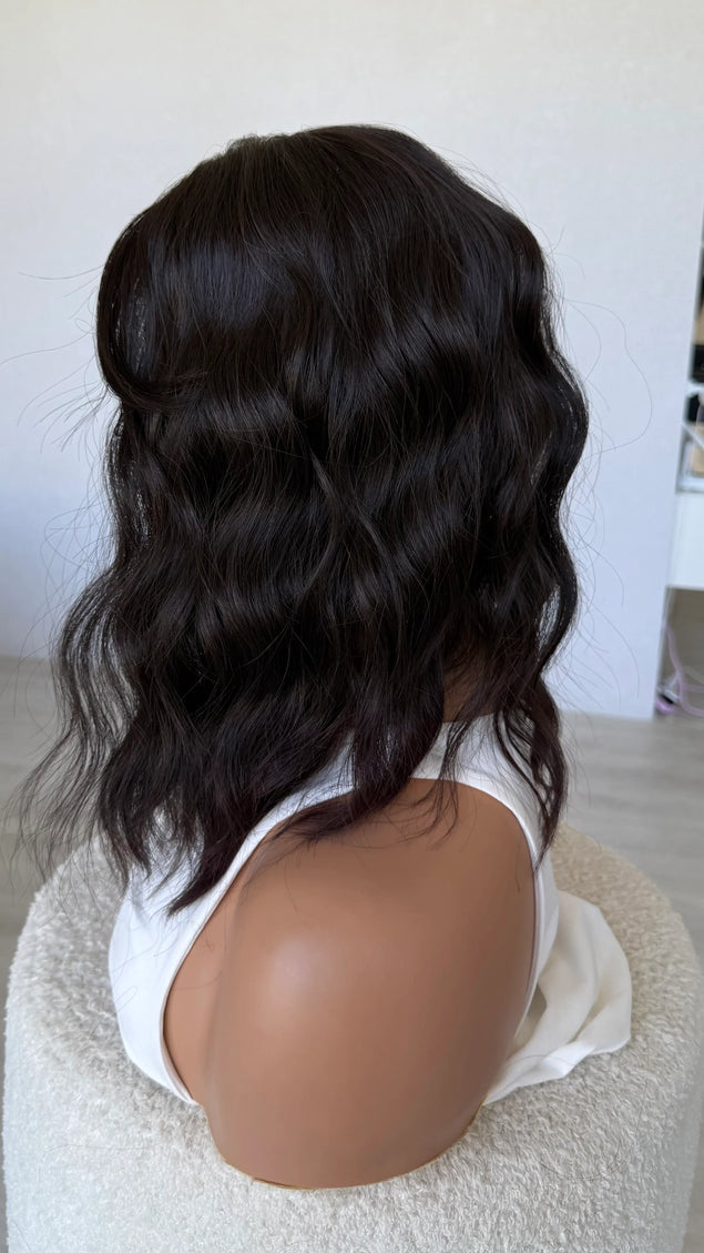 wavy hair synthetic side on view, dark brunette.