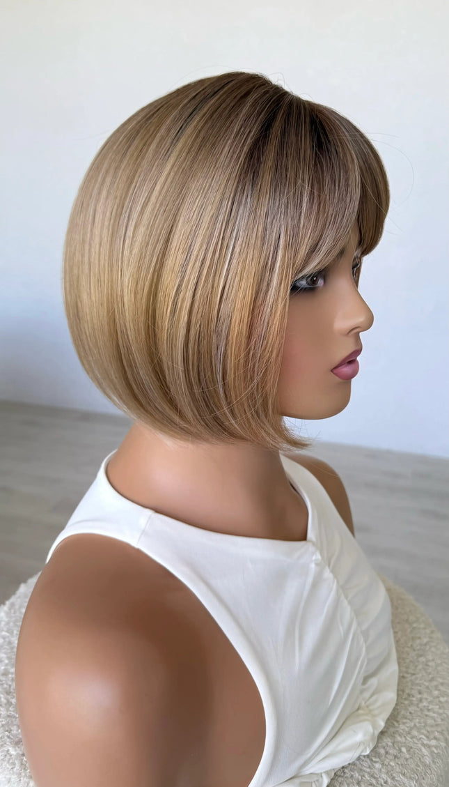 honey topper side on view, darker root mixed tone blonde warm toned.