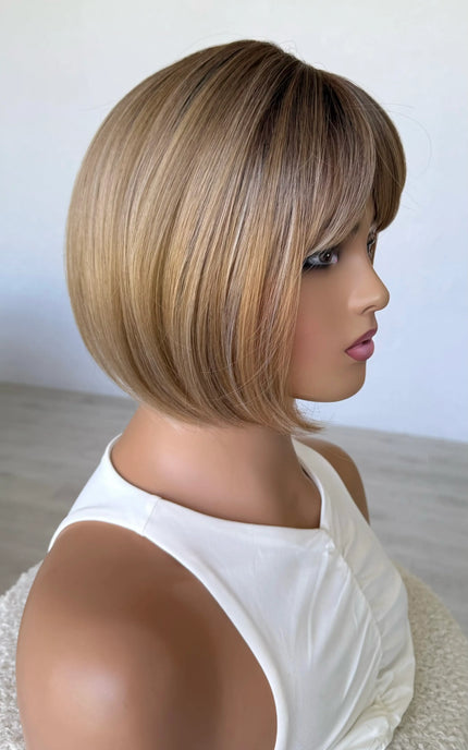 honey topper side on view, darker root mixed tone blonde warm toned.