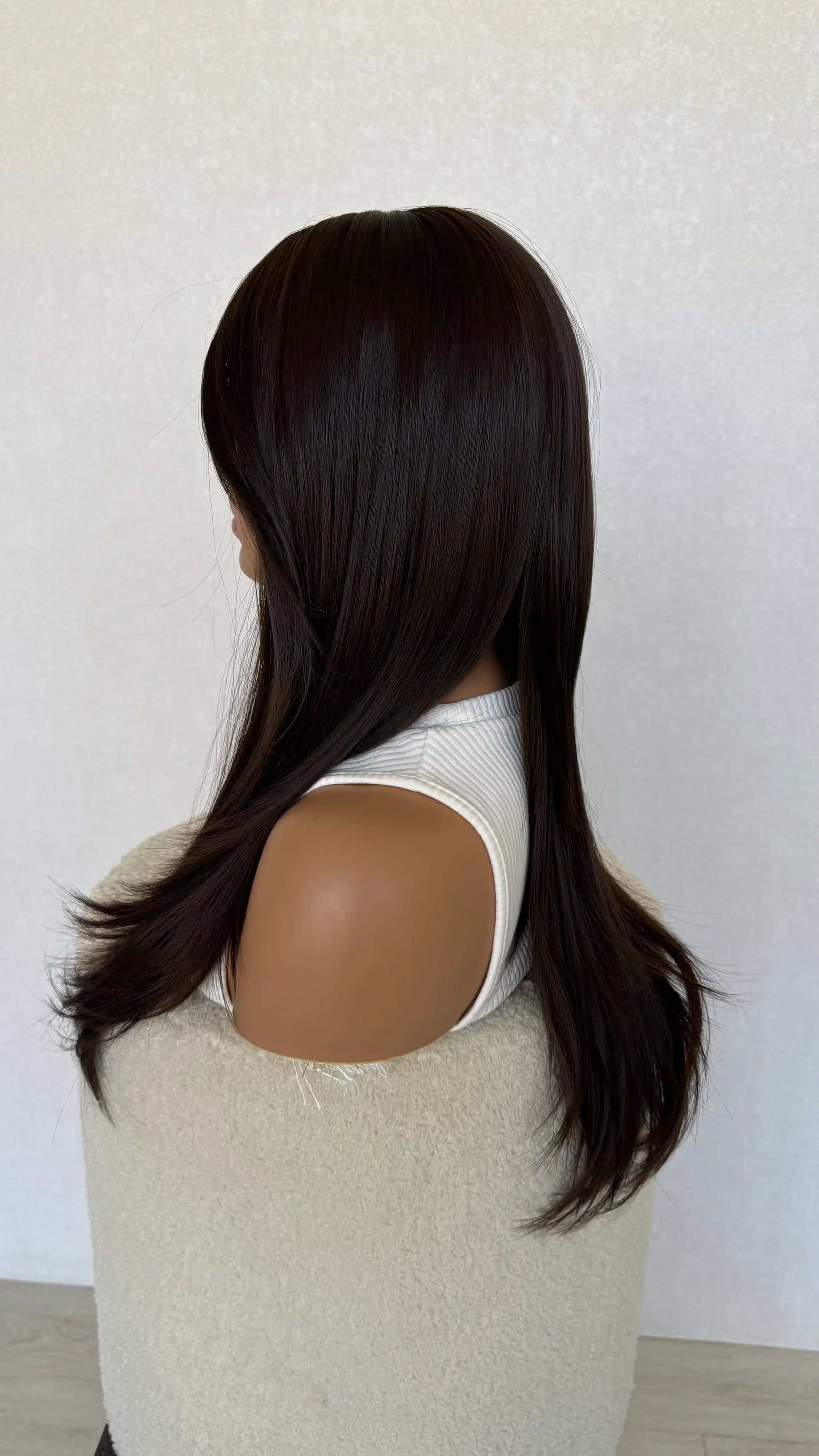 long layered brunette hair side view, middle part, heat safe hair.