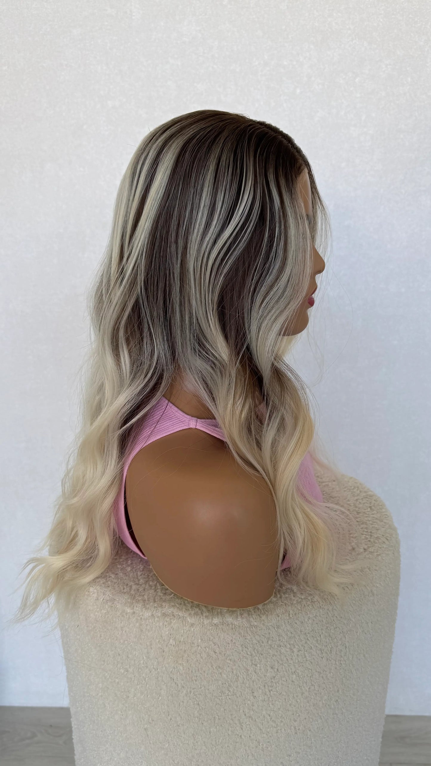 platinum blonde, ash brunette wig, side on view showing highlights.