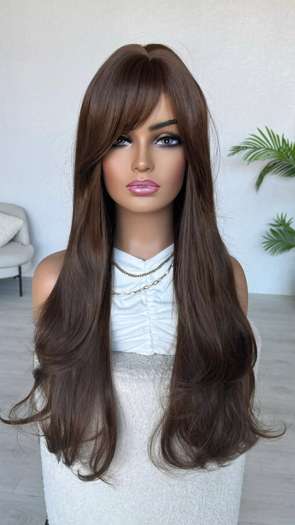 Mannequin head with long brown wig in a room setting