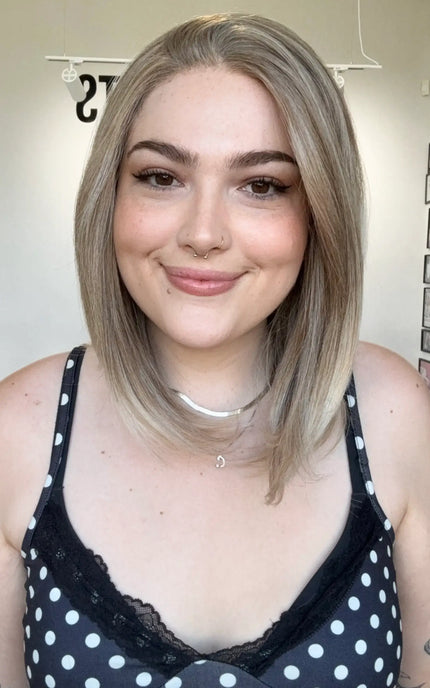 glueless petite size synthetic wig in sandy blonde colour, side part.