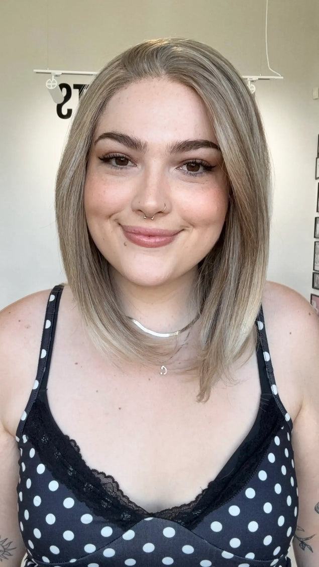 glueless petite size synthetic wig in sandy blonde colour, side part.
