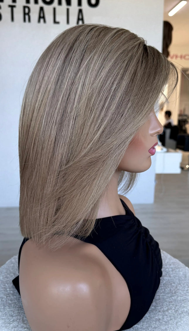 side view showing soft blend of blonde tones, cut to 14 inch with light face layering.