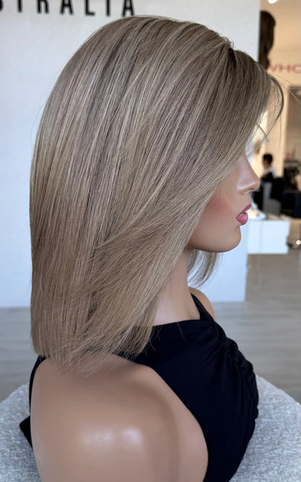 side view showing soft blend of blonde tones, cut to 14 inch with light face layering.