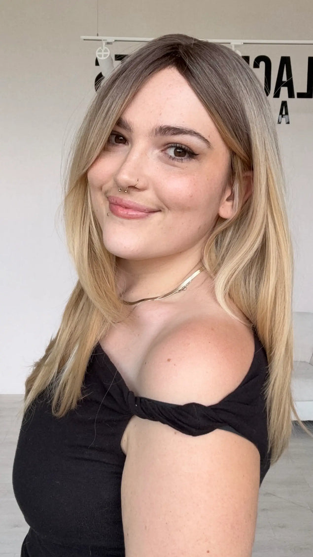 A side view, half hair forward, half back , long layers throughout, a warm blonde colour with a soft brunette blended root. perfect for hairloss, alopecia.