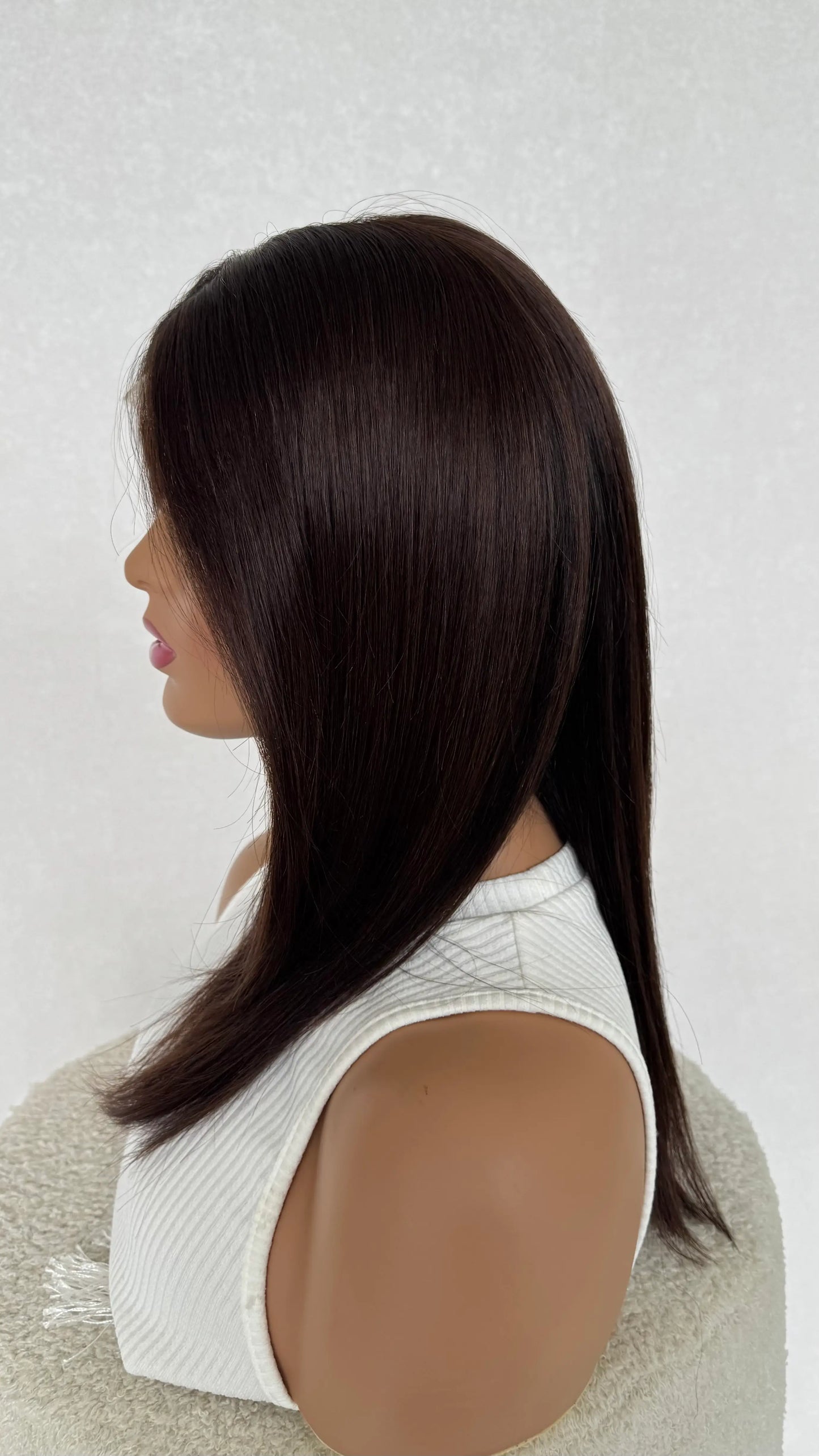 human hair lace front wig side on view, dark chestnut colour.