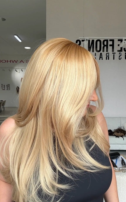 warm golden blonde layered hair glueless wig with a side view photo showing the golden light blonde colour.
