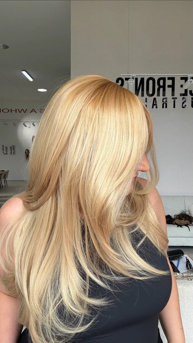 warm golden blonde layered hair glueless wig with a side view photo showing the golden light blonde colour.