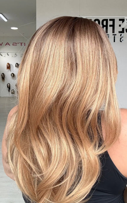 a side view of the golden blonde ombre ends, with the brunette shadow root for dimension and to create a natural look.