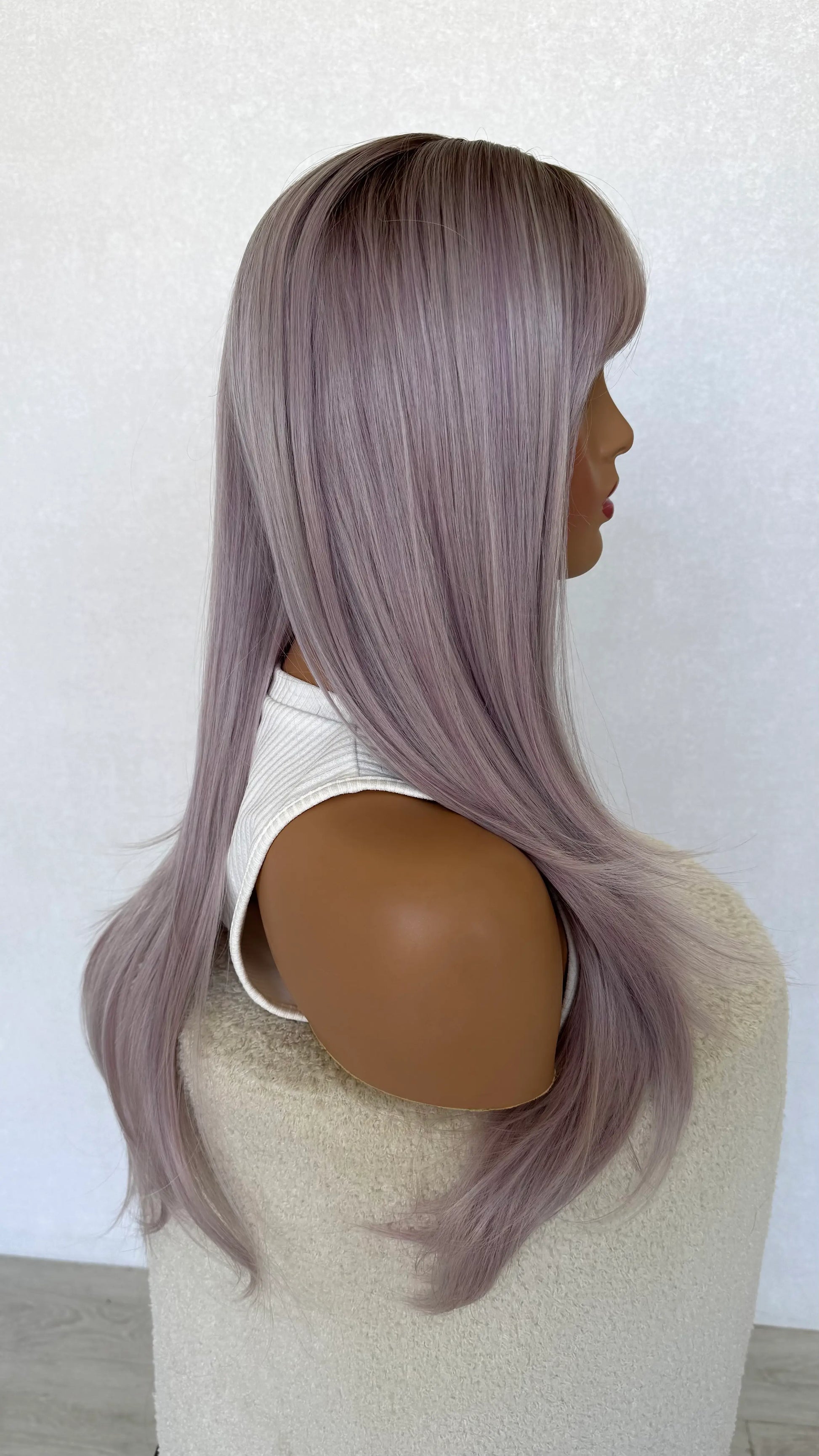 synthetic wig purple. side on view, long fringe wig.