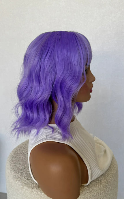 wavy purple hair wig, side on view, middle part, fringe synthetic wig.
