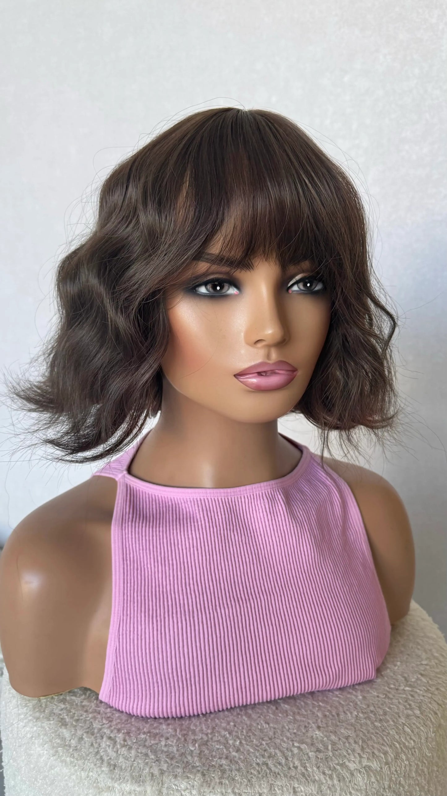 cool toned brunette wavy bob wig middle part. 