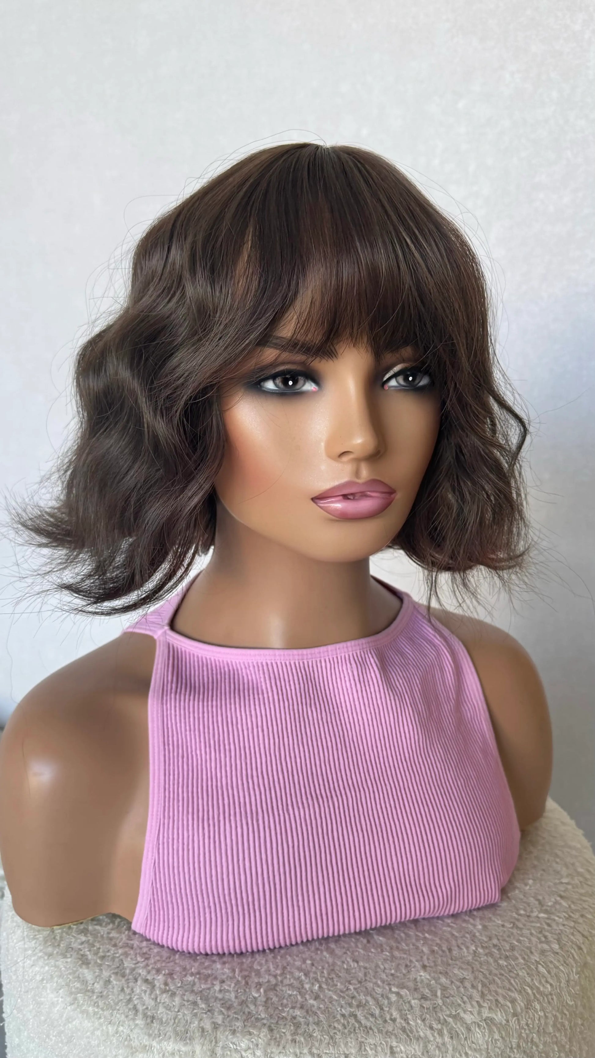cool toned brunette wavy bob wig middle part. 