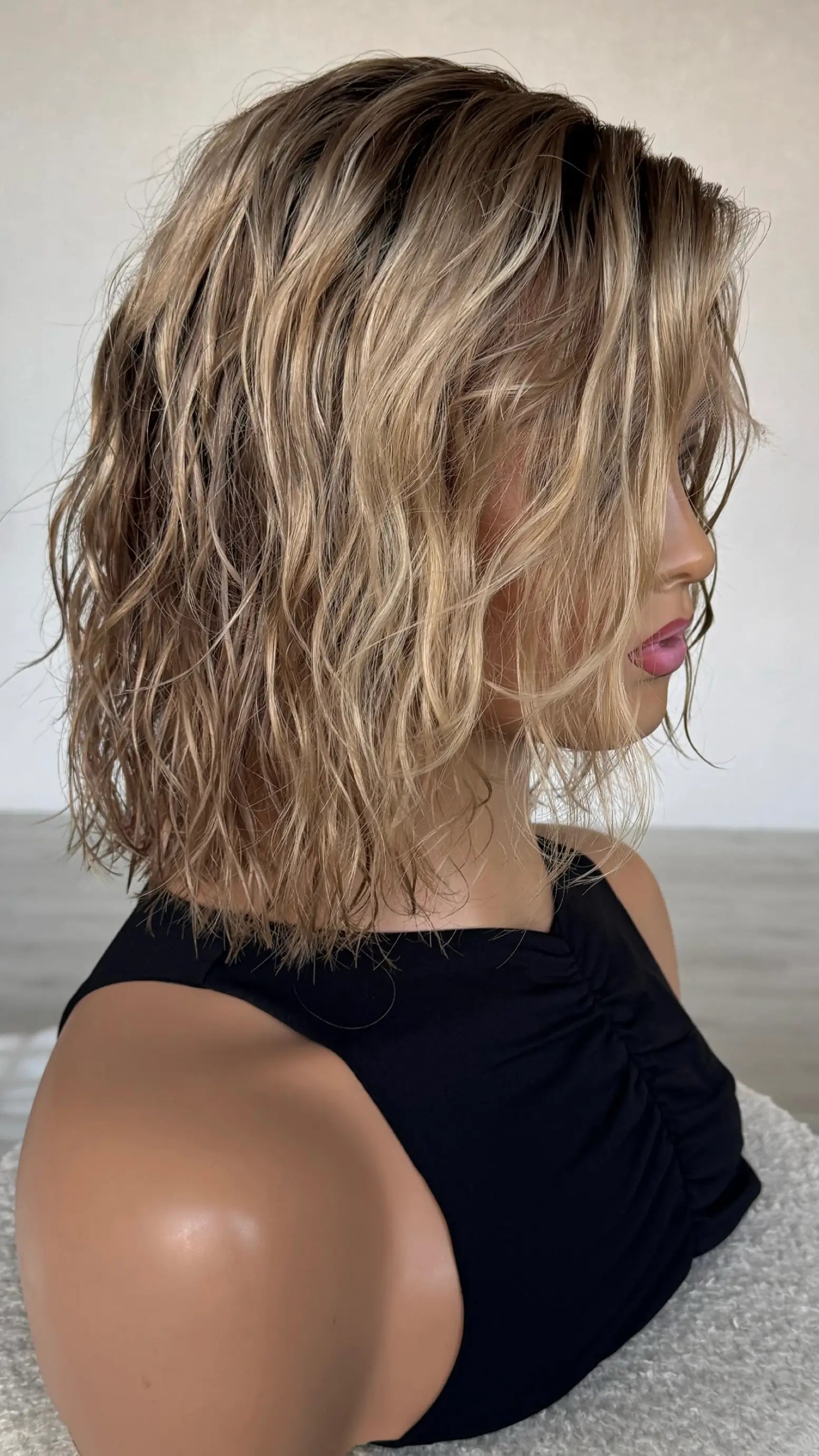 side view of wavy hair bob, 12 inch. blonde ombre hair, summer colour.