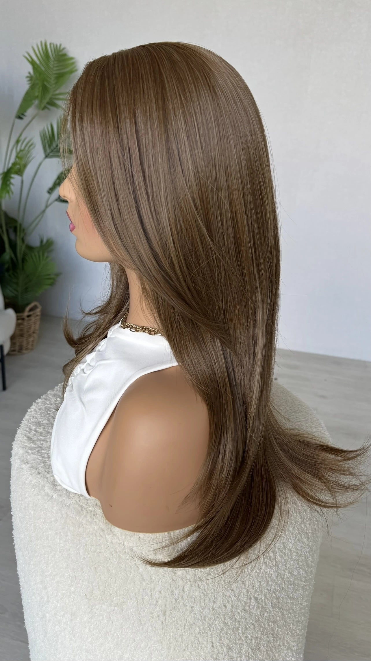 lacefront from the left side view, showing long layered hair with middle part.