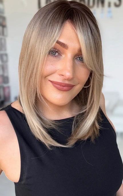 slight side part, with face framing layers for shaping around face, middle to slight side part, long bob length.