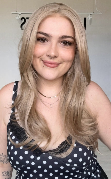 natural looking long rose beige blonde wig with glueless cap and heat safe hair.