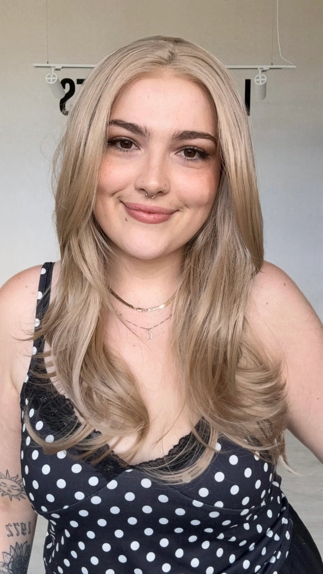 natural looking long rose beige blonde wig with glueless cap and heat safe hair.