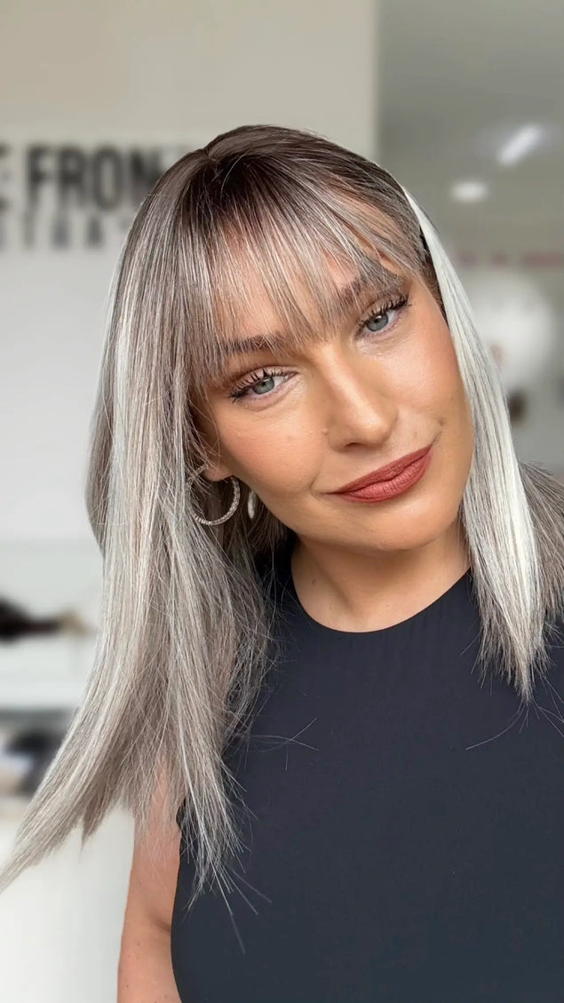 straight ash light grey hair long bob length with middle part and soft long fringe.