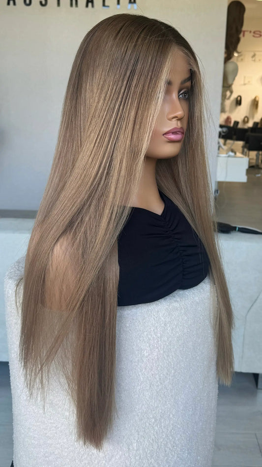 side on view of long blonde ombre hair, parted down the middle. long length 26 inches.