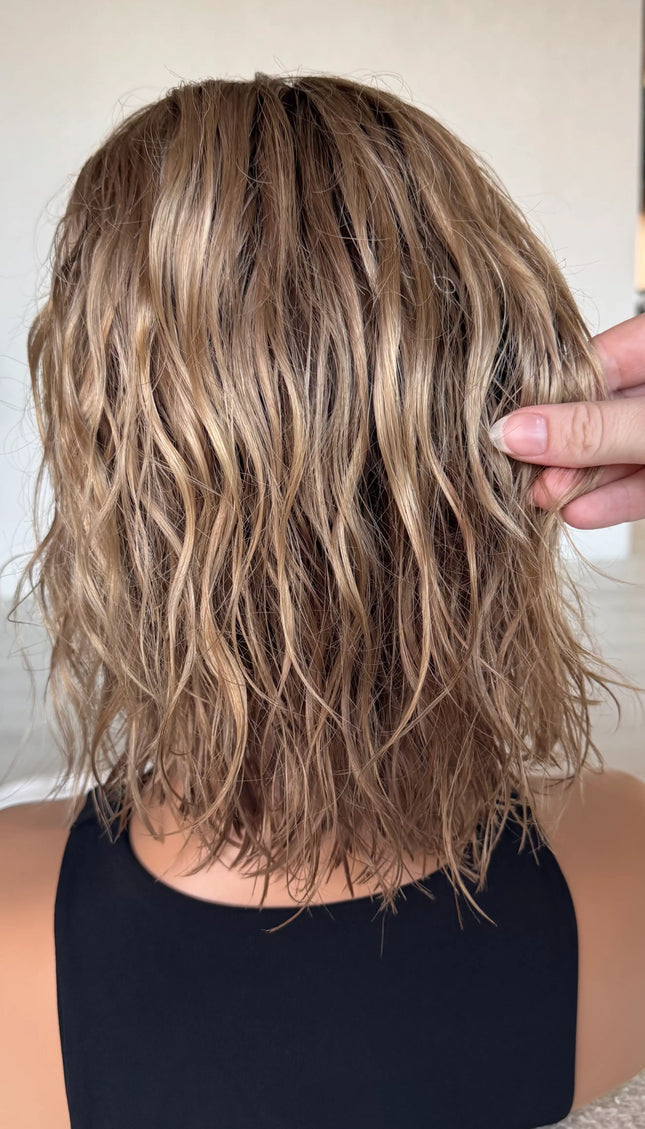 wavy hair from back view, holding blonde ombre hair. summer colour, natural hair lacefront wig.