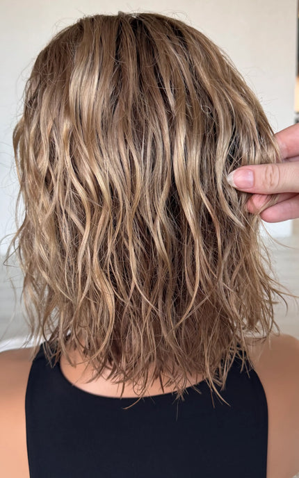 wavy hair from back view, holding blonde ombre hair. summer colour, natural hair lacefront wig.