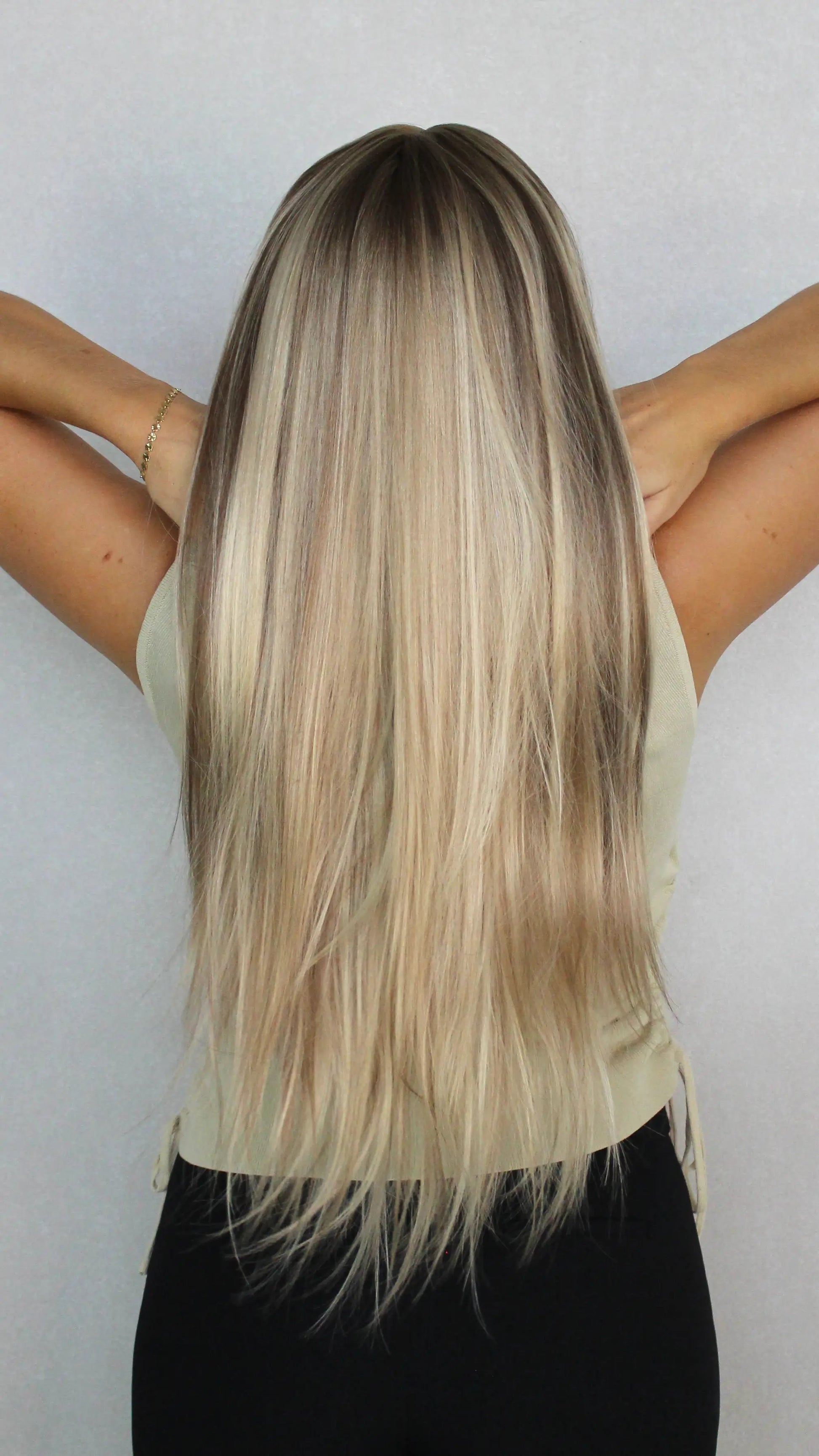 synthetic wig from the back, showing natural hair colours. long length hair, heat safe. 